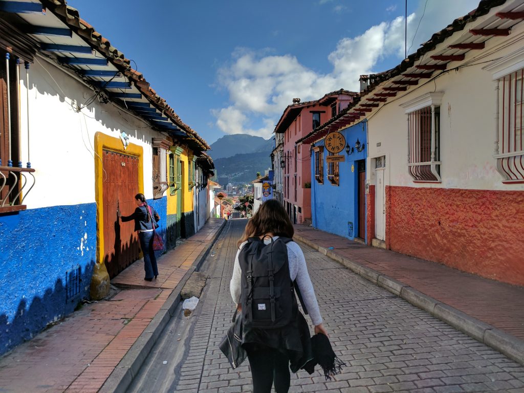 a girl backpacking in a columbian village